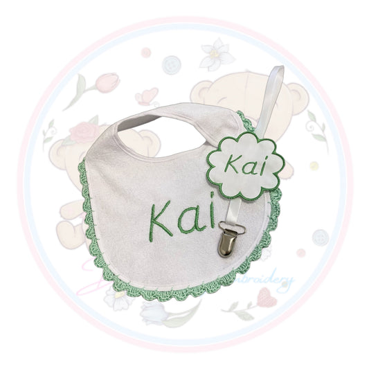 Crochet bib with matching dummy clip